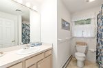 Full bathroom with tub and shower serves the upstairs bedrooms